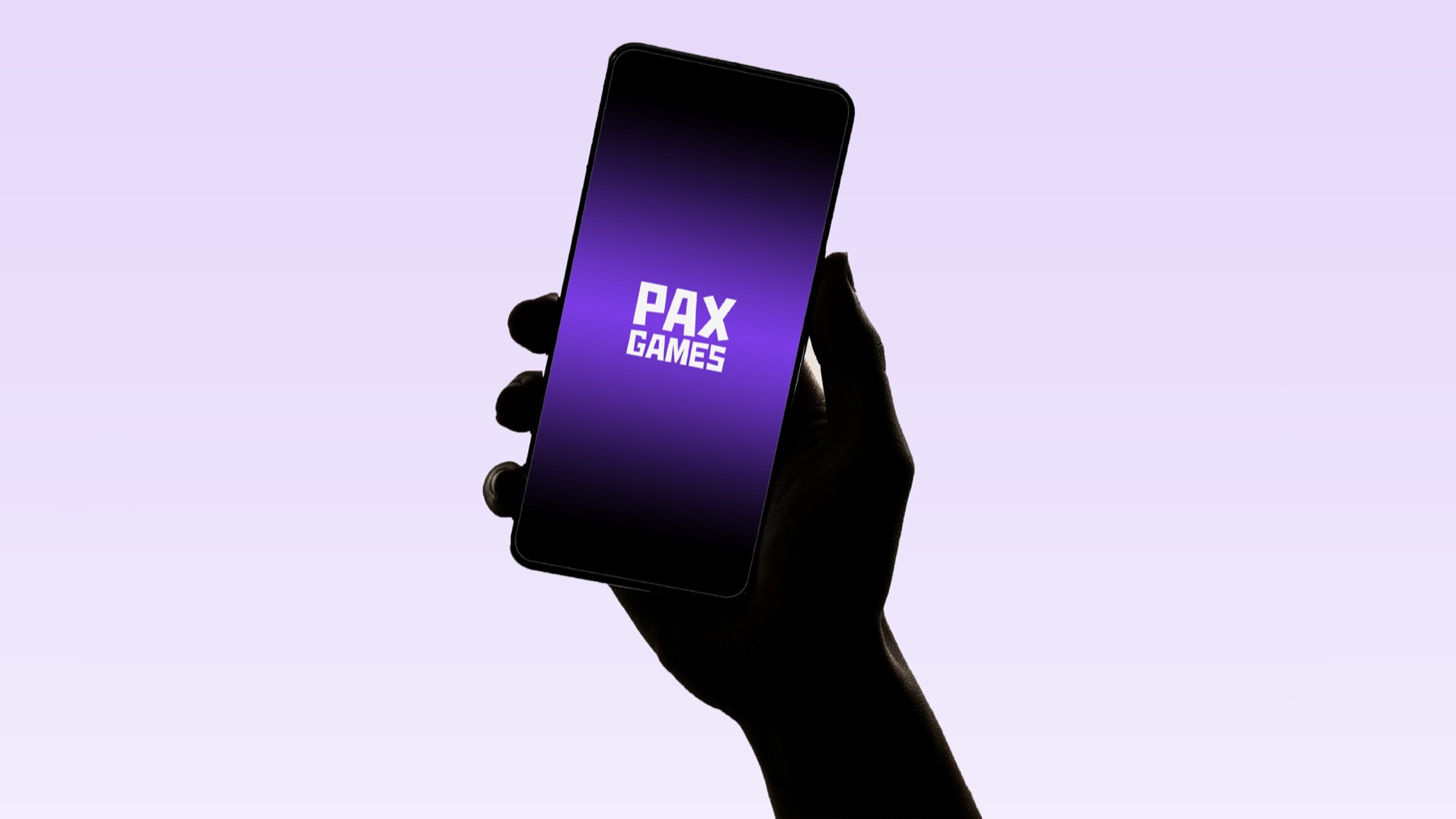 The Pax Games logo glowing purple on a phone held in one hand